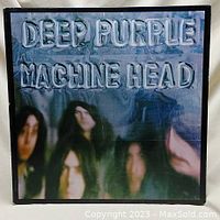 Front album cover with metallic embossed text and blurred band image.