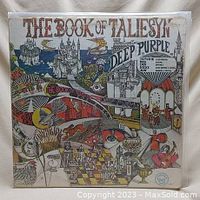 Front cover of Deep Purple's The Book of Taliesyn vinyl album showing psychedelic-style illustration and band name.