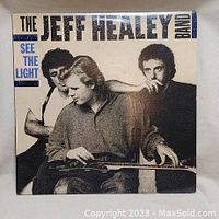 Front cover of vinyl LP "See the Light" by The Jeff Healey Band showing black and white photo of band members.