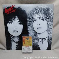 Vinyl album Bebe Le Strange by Heart in black and white cover with faces of band members, with cassette tape on top