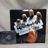 Judas Priest British Steel vinyl album cover showing hand holding a razor blade.