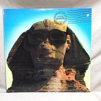 Front cover of Kiss Hot in the Shade vinyl LP showing the Sphinx wearing sunglasses graphic.