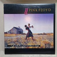 Front cover of Pink Floyd vinyl record 'A Collection of Dance Songs' showing a couple dancing in a rural field with house in background.