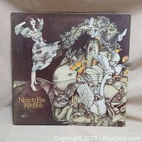 Front cover of Kate Bush vinyl LP album "Never for Ever" showing detailed whimsical artwork with dancing woman, animals, and birds