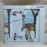 Front cover of Genesis Trespass vinyl album showing original cover artwork with stylized columns, landscape, and figures