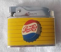 Front side of the 1960s Pepsi-Cola lighter showing the Pepsi bottle cap logo on yellow background with horizontal stripes and the chrome top with Asquith engraving.