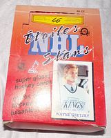 Photo of the full box showing the orange-red gradient box featuring Wayne Gretzky card image and indication of 48 packs.