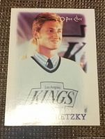Close-up image of mini hockey card showing Wayne Gretzky in a white Los Angeles Kings jersey, detailed and clear image of card front.