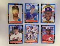 Photo of six individual 1988 Donruss baseball cards displayed including Roberto Alomar, Mark Grace, Andre Dawson, Roger Clemens, Fernando Valenzuela, Tim Raines