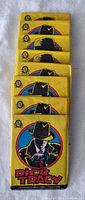 Photo showing eight unopened Dick Tracy trading card packs stacked vertically.