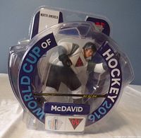 Front view of Connor McDavid figurine in its original sealed packaging with clear plastic casing showing the figure in North America team colors and World Cup of Hockey 2016 branding.