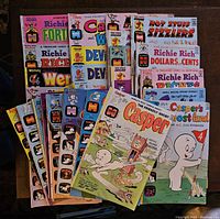 Photo of 25+ used Harvey Comics from the 1970s featuring Casper, Hot Stuff, Richie Rich, Wendy, Devil Kids and more.
