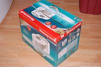 Photo of the Honeywell HCM-6009 humidifier box showing branding, product image, and features.