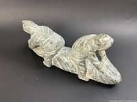 Front perspective showing both figures and base