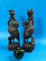 Both bird-shaped candlestick holders with green apple size reference