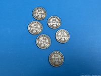 Reverse side view of all six 1912 Newfoundland 20 cent coins showing denomination and date