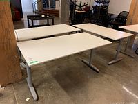Three desks arranged in showroom space