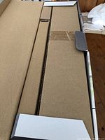 Unopened cardboard packaging of the serving set