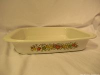 Photo of the rectangular vintage Corning Ware baking dish showing the fruit pattern around the sides and wide rim handles.