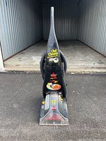 Front view of Bissell ProHeat carpet cleaner showing branding and operating labels