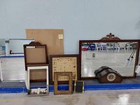 Full lot showing both classic mirrors, mantle clock, herb rack, picture frames, calendar holder, and bathroom decoration.