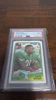 Front view of the 1988 Topps Jerome Brown rookie football card encapsulated and graded PSA 9 Mint.