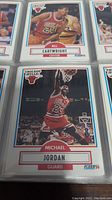 Close up of 1990 Fleer basketball card featuring Michael Jordan in Bulls uniform dunking