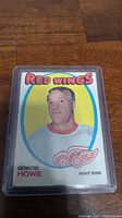 Front of 1971-72 Topps Gordie Howe hockey card showing player portrait with Detroit Red Wings logo and name.
