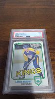 Front view of 1981-82 Topps Larry Murphy rookie card in PSA holder showing the card's condition and grading label.