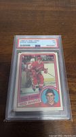 Front view showing Steve Yzerman in Red Wings uniform, card number 67, PSA grading label EX 5.