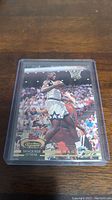 Front view of the Shaquille O'Neal rookie card showing him in Orlando Magic jersey during gameplay with crowd in background.