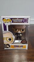 Front view of Stan Lee Funko Pop figure in sealed box with protective casing showing Guardians of the Galaxy 281 label.