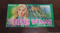 Game box with cover showing illustration of The Bionic Woman and kangaroo, with game title and branding.