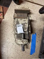 Overhead view of Bridgesun vise showing top metal jaws, handle, and base with a MaxSold tag on top