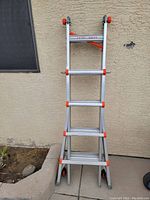 Photos of Little Giant Speed Level multi-position ladder leaning on a wall. Shows ladder fully folded and close-ups of rung steps and adjustment mechanisms.