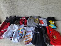 Overview of all shirts laid out showing variety and condition