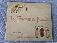 Front cover of the book titled "La Fontaine's Fables" with illustrations and title in red lettering.