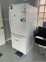 Front and side exterior view of white refrigerator