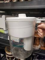 White and transparent Brita water filter pitcher with handle and spout, showing measurement markings and Brita branding.