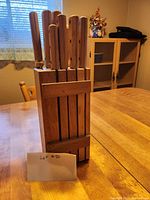 Front view of the wooden knife block with knives inserted