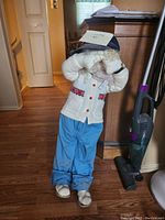 Front view of standing doll showing outfit and hair details