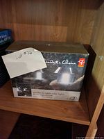 Box of Retailer's Choice garden-to-table solar lights containing two lights.