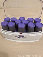 White Conair Mr Big Curls volume hair setter with 12 purple-topped curling rods inside, clear plastic lid open showing rods.