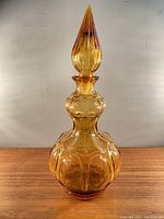 Front view of vintage amber glass corset genie bottle
