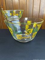 Front and angled view of vintage chip and dip bowls with colorful spice names and brass bracket