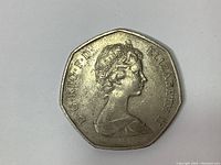 Obverse side of the 1973 Great Britain 50 pence coin showing Queen Elizabeth II's portrait with inscription.
