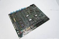 Top view of the Mitutoyo chip PC plug-in board showing the entire circuit layout and various components mounted on the green PCB.