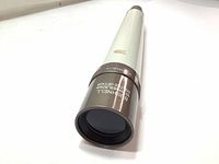 Front view of the vintage Bushnell spotting scope showing coated lens and branding.