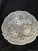 Top view showing the detailed cherry fruit and leaf pattern etched inside the frosted glass bowl.