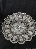 Top view of the vintage glass egg server plate showing all 15 egg slots and textured circular center pattern